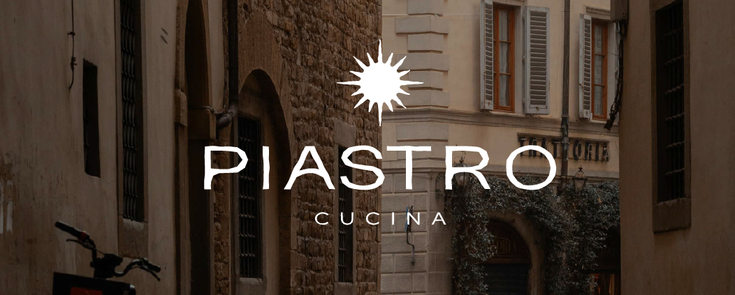 Piastro Cucina hero - fachada real com logo dourado